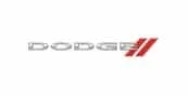 The image shows the Dodge logo with the word DODGE in silver capital letters, followed by two red diagonal stripes to the right.