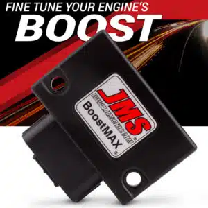 A black JMS BoostMAX automotive performance chip is shown in front of a red and black background with light trails and the text FINE TUNE YOUR ENGINES BOOST at the top.