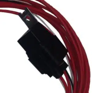Close-up of a black electrical connector attached to several coiled red wires, with a metal mounting bracket visible at the top.