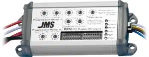 A JMS Progressive Nitrous Oxide (Nâ‚‚O) Controller with dials, switches, indicator lights, and labeled wiring for managing RPM, enable windows, fuel, and Nâ‚‚O settings.
